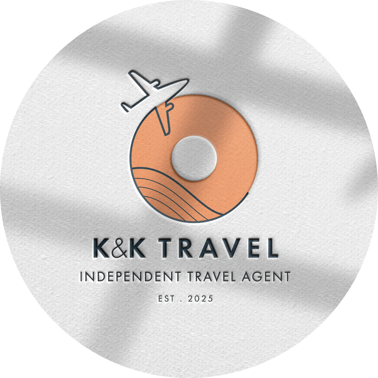 K and K travel logo in a gold circle with scripted text in the centre